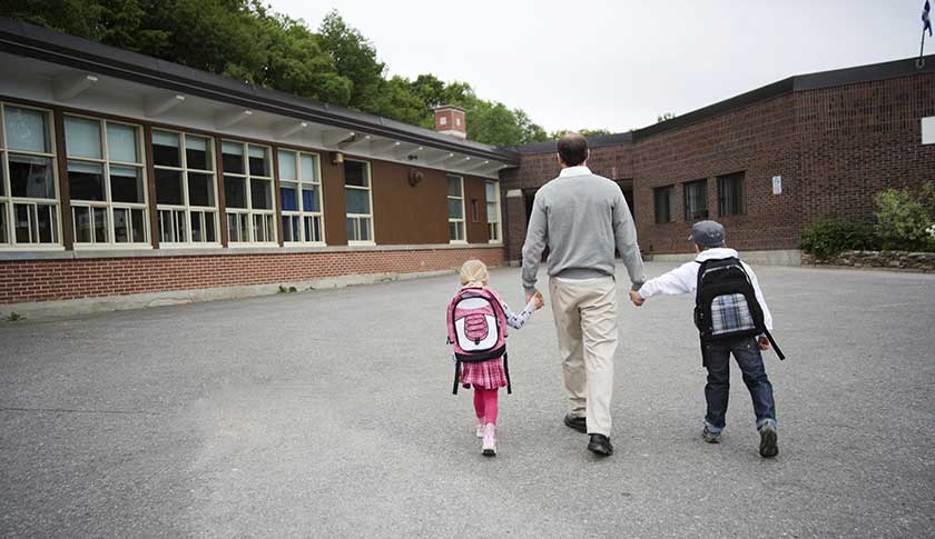 child man walking to school