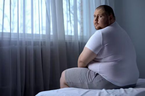 fat man on bed